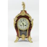 French tortoiseshell and ormolu mantel clock, circa 1910, surmounted with a figure of Cupid, cream