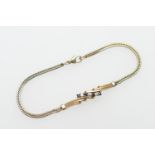 Gold and sapphire herringbone bracelet, set with seven round cut blue and white stones, unmarked,