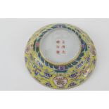 Chinese yellow ground saucer dish, 20th Century, decorated with calligraphic medallions against a