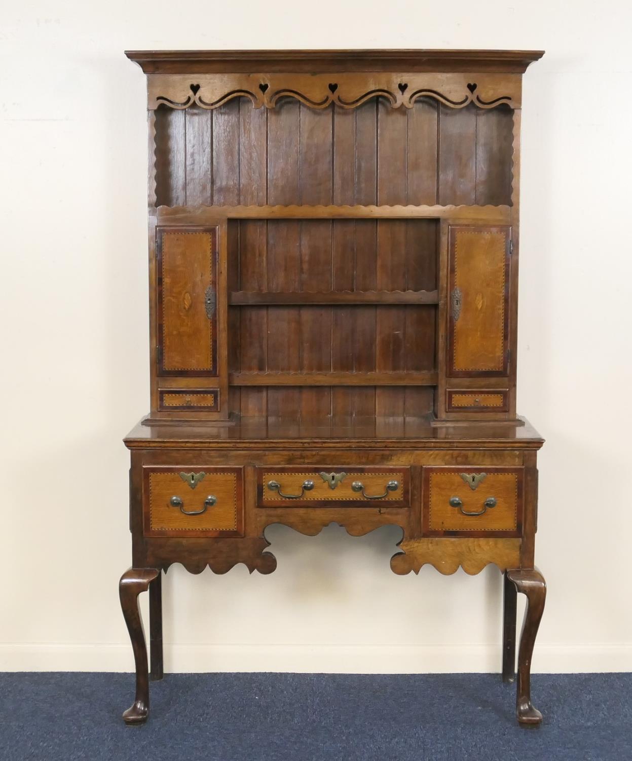 Oak and mahogany dresser and plate rack, of small proportions, the boarded back with four shelves,