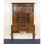 Oak and mahogany dresser and plate rack, of small proportions, the boarded back with four shelves,