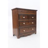 Apprentice piece chest of drawers, finished in oak with mahogany banding, with three false drawers