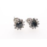 Pair of white and blue sapphire cluster earrings, centred with a cushion cut sapphire bordered