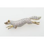 Diamond pave running fox brooch, set with small round cut diamonds and a single ruby eye, set in