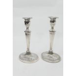 Pair of modern silver candlesticks, London 1963, in the Adam style with urn shaped sconce, tapered
