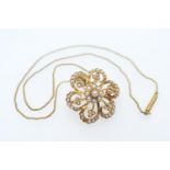 Edwardian 15ct gold pearl pendant brooch, worked as a flowerhead, 27mm diameter, suspended from an