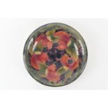 William Moorcroft Pomegranate plate, with everted rim, painted signature and impressed marks, 23cm