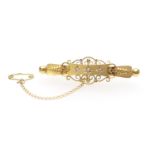 Edwardian 15ct gold and diamond bar brooch, set with three tiny round cut diamonds in a cannetille