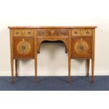 Edwardian mahogany and inlaid serpentine sideboard, in the Georgian style, the crossbanded top