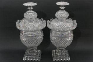 Pair of Irish cut glass lidded jars, 19th Century, strawberry and fan cut throughout with mushroom