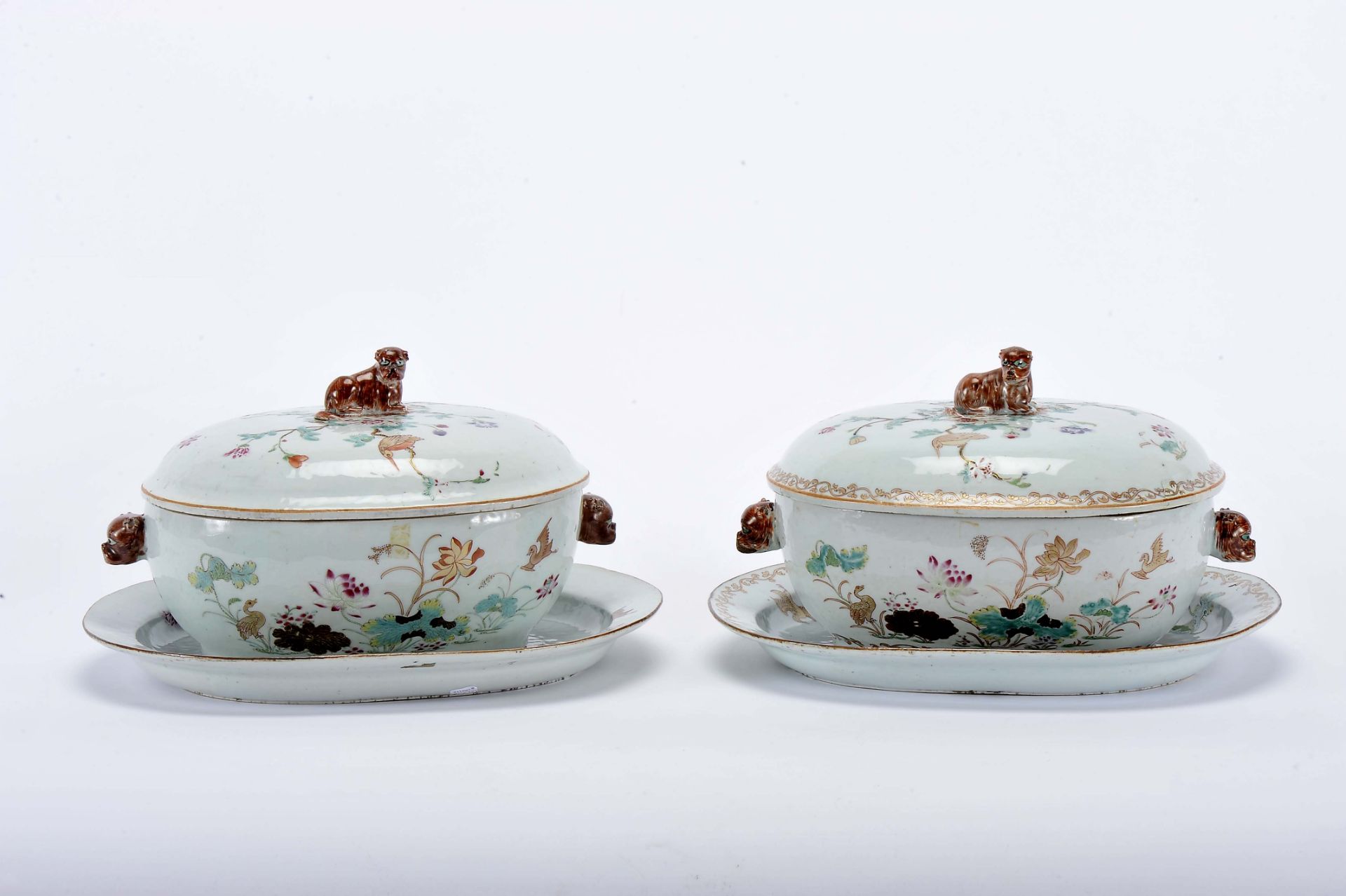 Two tureens with stands
