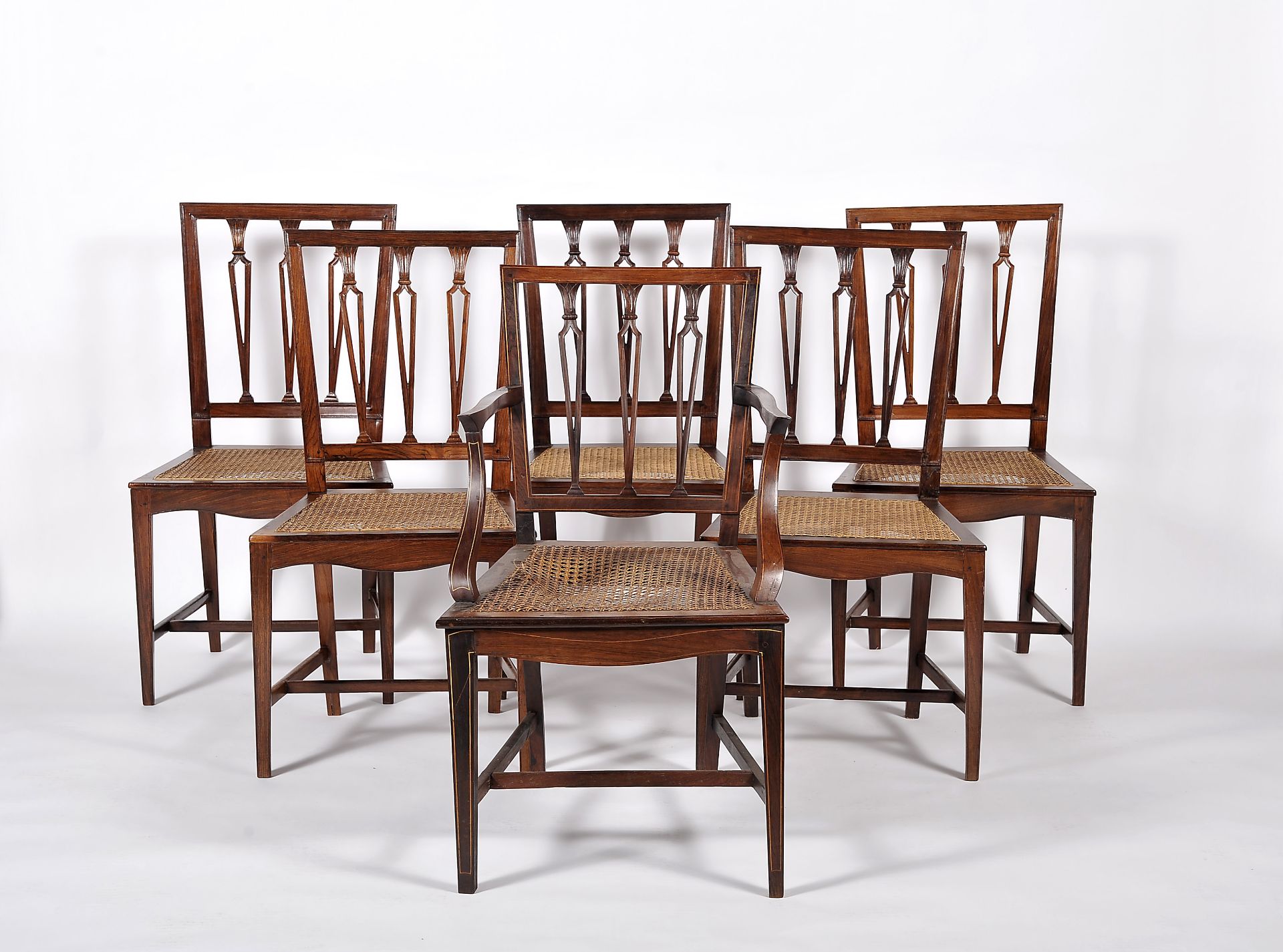 A set of twelve chairs including two armchairs