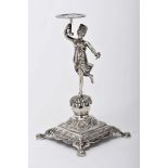 A toothpick holder "Dancer in turban holding a cup"