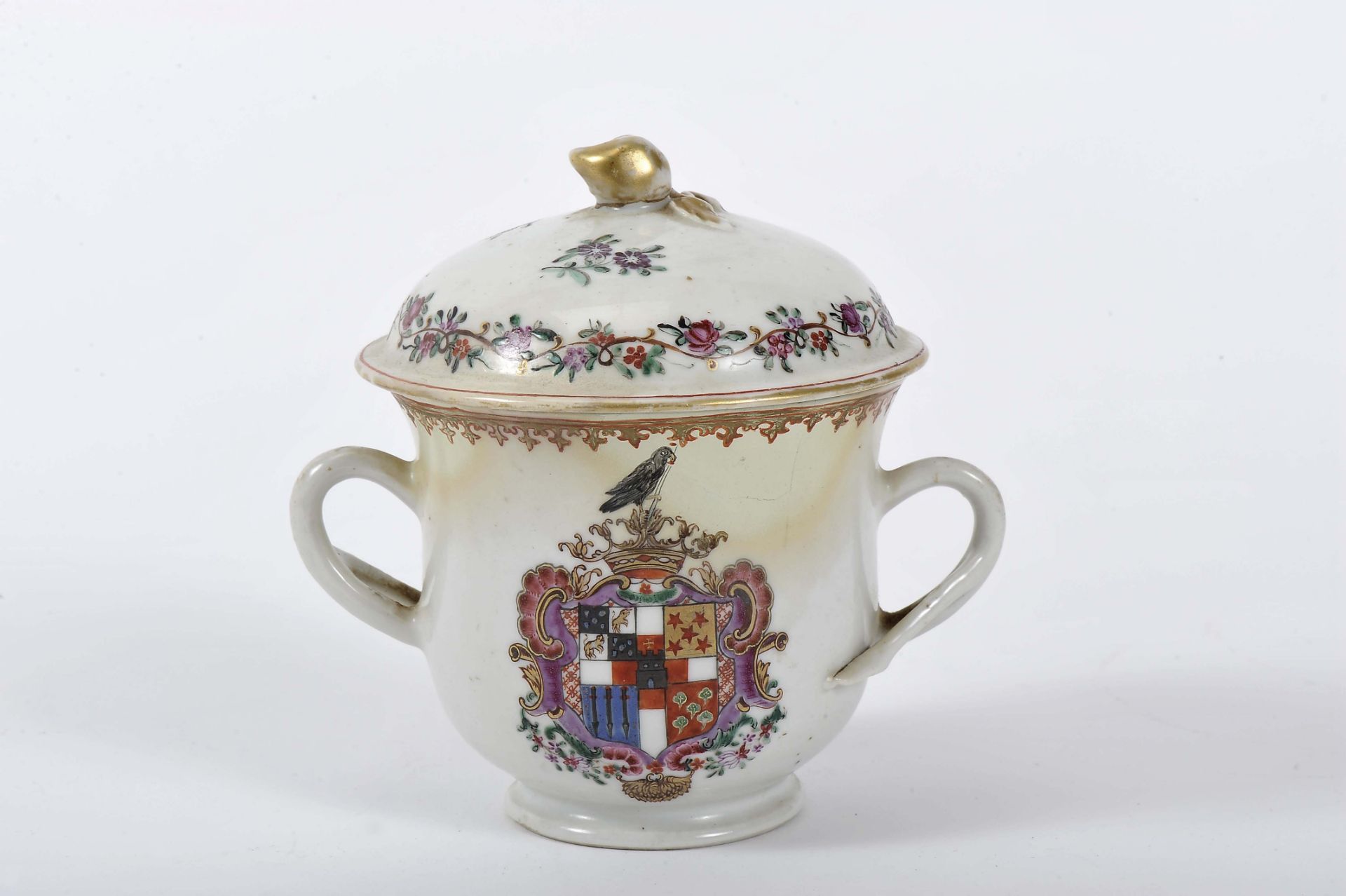 A sugar bowl with cover