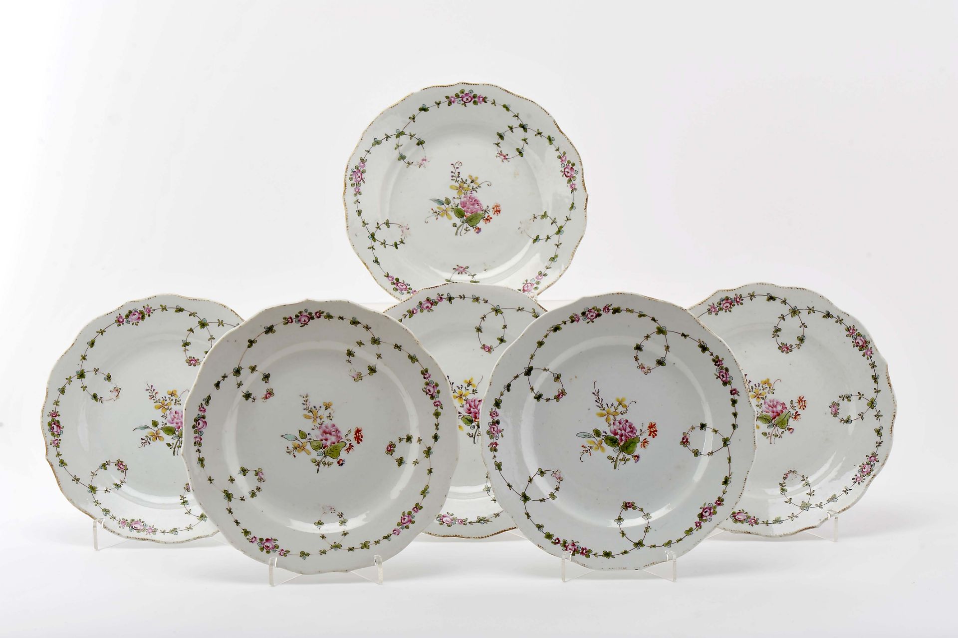 A set of six scalloped dishes
