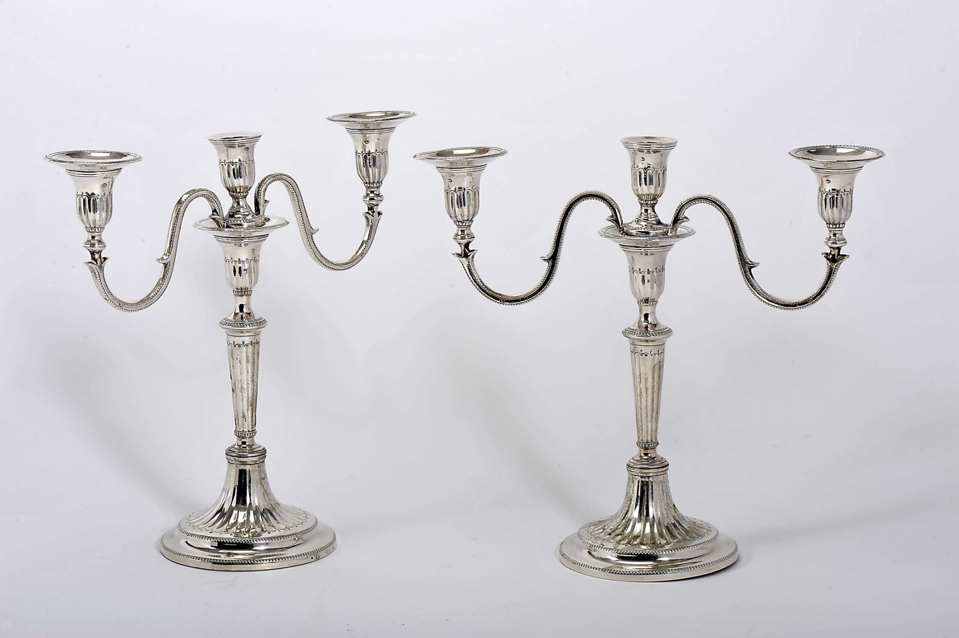 A pair of three-light candelabra