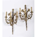 A pair of three-light wall sconces