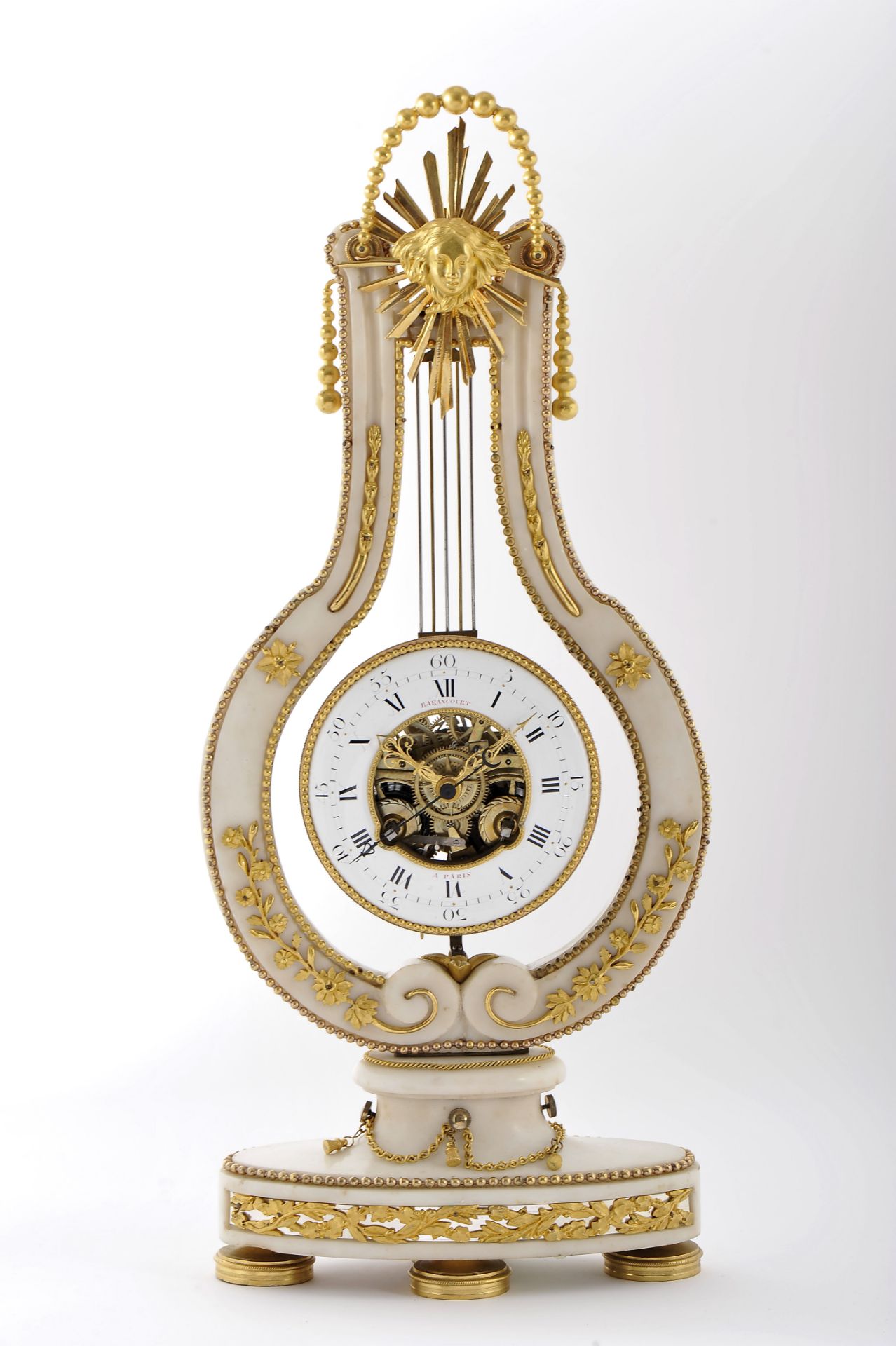 A lyre-shaped pendulum table clock