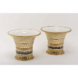 A pair of tall baskets
