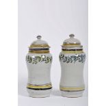 A pair of covered pharmacy pots