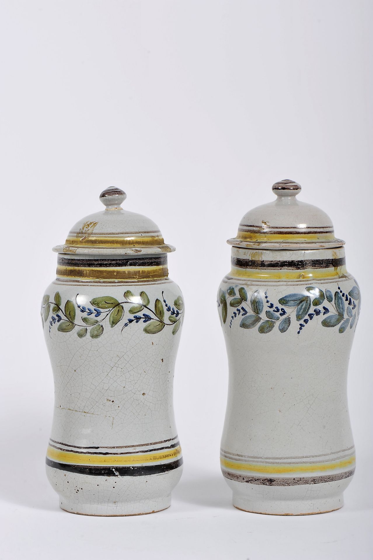 A pair of covered pharmacy pots