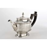 An oval teapot