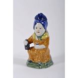 A covered jug "Seated female figure with bottle and glass"