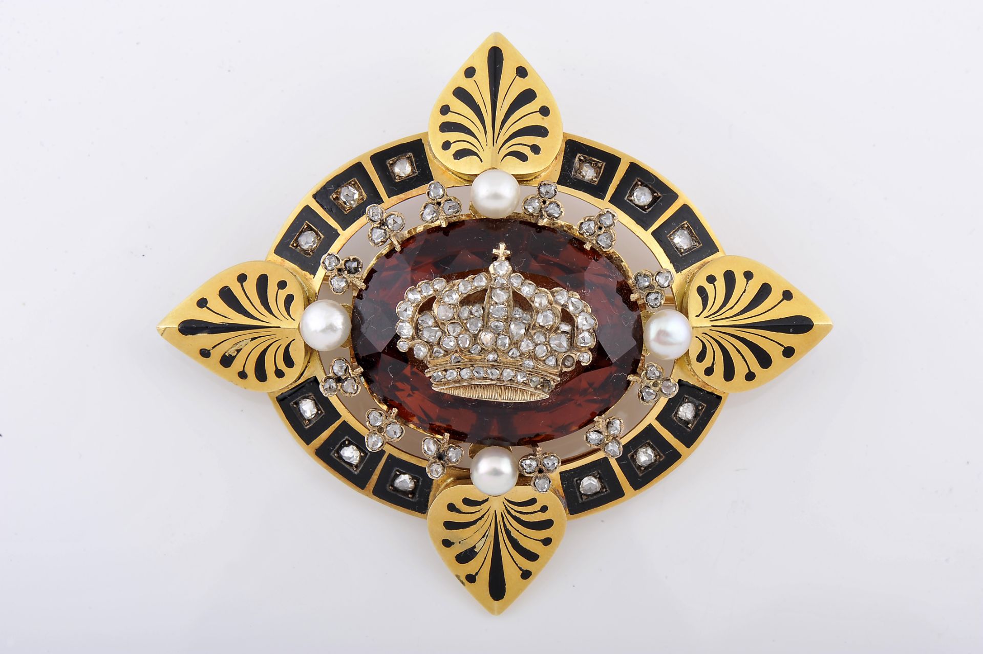 A brooch with a royal Crown