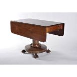 A drop leaf table with drawer