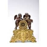 A table clock - Two sculpturesAlegorical Putti to literature and Painting