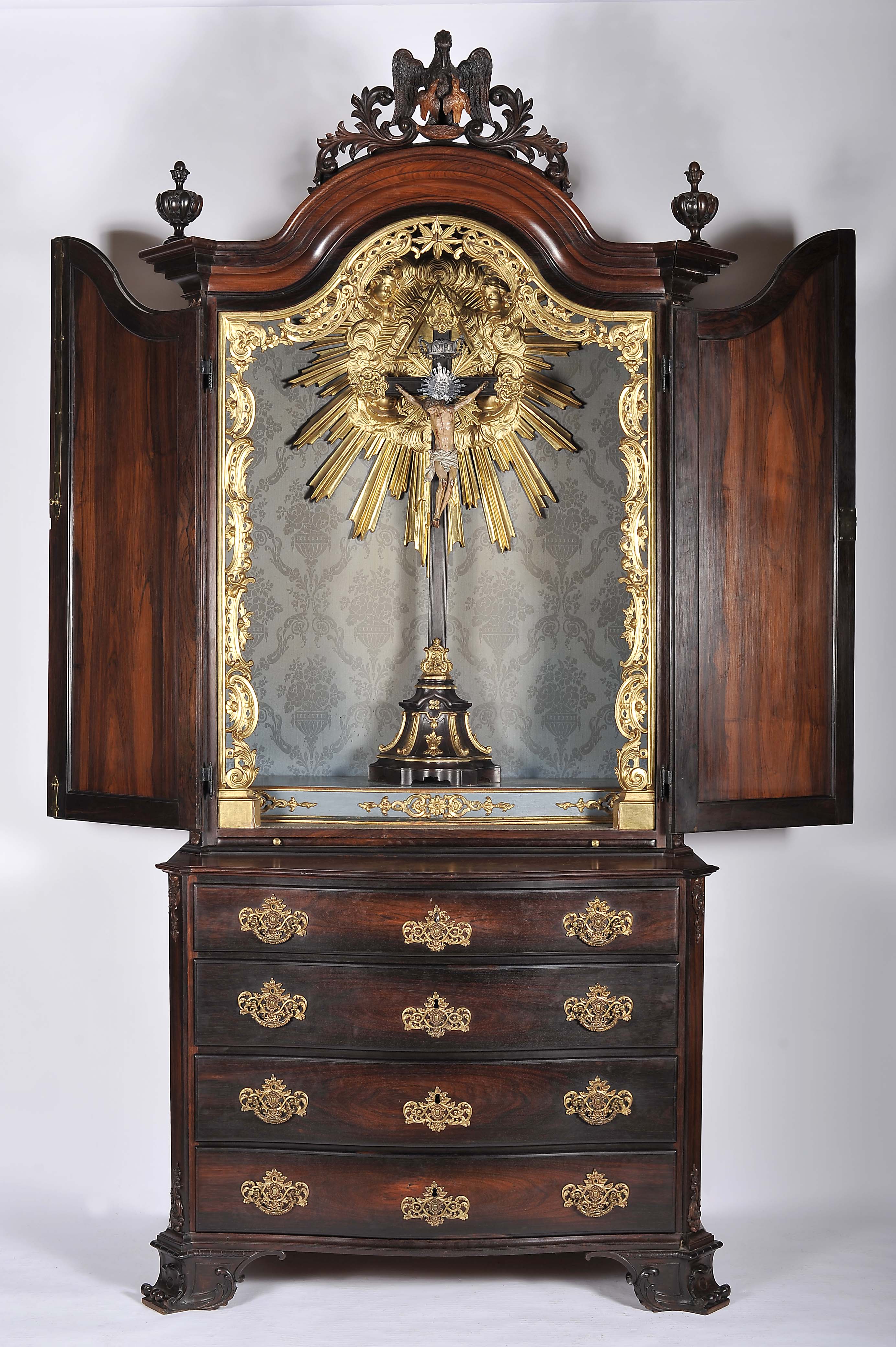 A chest of drawers with oratory top and drawing board