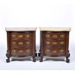 A pair of demilune chest of drawers