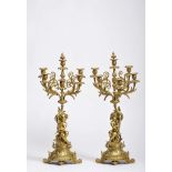 A pair of five-light candelabra "Putti holding branches"