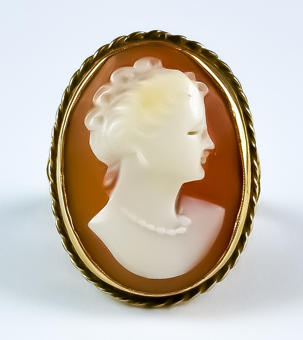 A Carved Cameo Ring, 20th Century, the carving depicting the bust of a young lady, 20mm x 13mm, size
