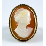 A Carved Cameo Ring, 20th Century, the carving depicting the bust of a young lady, 20mm x 13mm, size