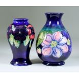 A Moorcroft Pottery Vase, tube-lined and decorated in colours with "Clematis Design", 7.25ins