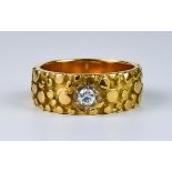A Gold and Diamond Dimple Ring, Modern, 18ct gold set with a small brilliant round diamond,
