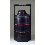 A South East Asian Black and Red Lacquer Three Tier Rice Basket, of cylindrical form with