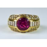 A Ruby and Diamond Ring, Modern, 18ct gold, set with a central faceted ruby, approximately 1ct,