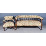 A Victorian Walnut Framed Tub-Shaped Settee, with spindle turned back, upholstered crest rail and