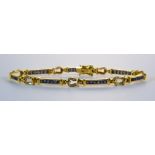A Sapphire and Diamond Bracelet, Modern, 18ct gold set with baguette cut sapphires, approximately