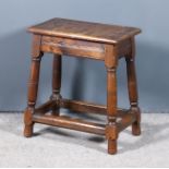 An Old Oak Joint Stool with Moulded Edge to Top, on turned legs and moulded stretchers, 18.5ins x