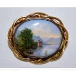 A Victorian Brooch, yellow metal, with decorated panel depicting lake side scene, inscribed to the