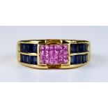 A Blue and Pink Sapphire Ring, Modern, 18ct gold set with six small faceted pink sapphires to the