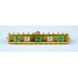 A Emerald and Diamond Bar Brooch, 20th Century, 14ct gold set with two small brilliant cut diamonds,