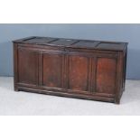 A Late 17th Century Panelled Oak Coffer, with four panelled lid and front, the whole with moulded