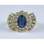 A Sapphire and Diamond Ring, Modern, 18ct gold set with a central sapphire, approximately 1.5ct,
