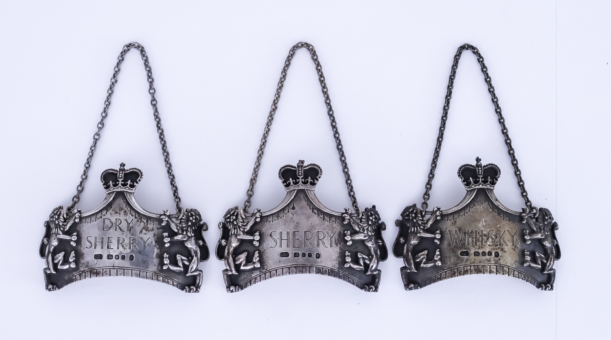 Three Elizabeth II Silver "Coronation" Spirit Labels, by Leslie Gordon Durbin, London 1953,