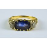 A Sapphire and Diamond Three Stone Ring, 20th Century, 18ct gold set with a centre oblong