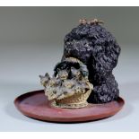 An Austrian Cold Painted Bronze Inkwell, in the form of a poodle's head holding a basket of